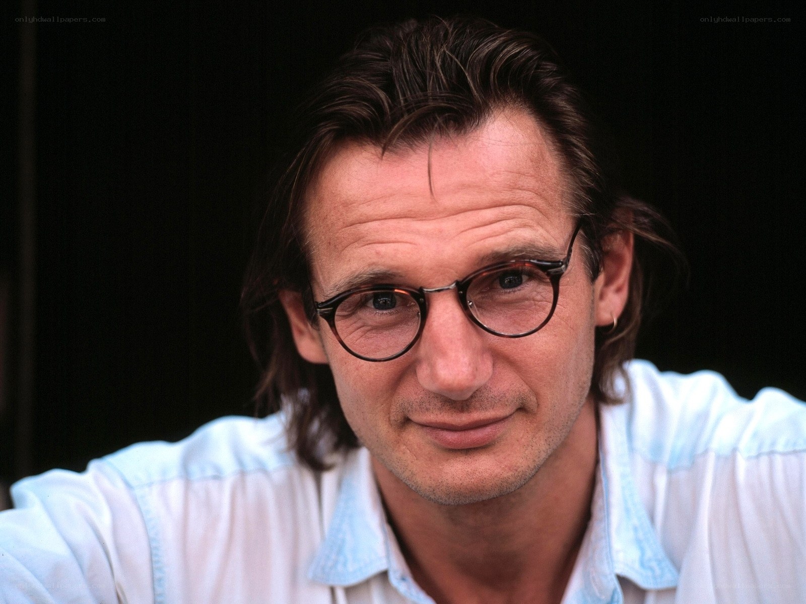 man with glasses and white shirt