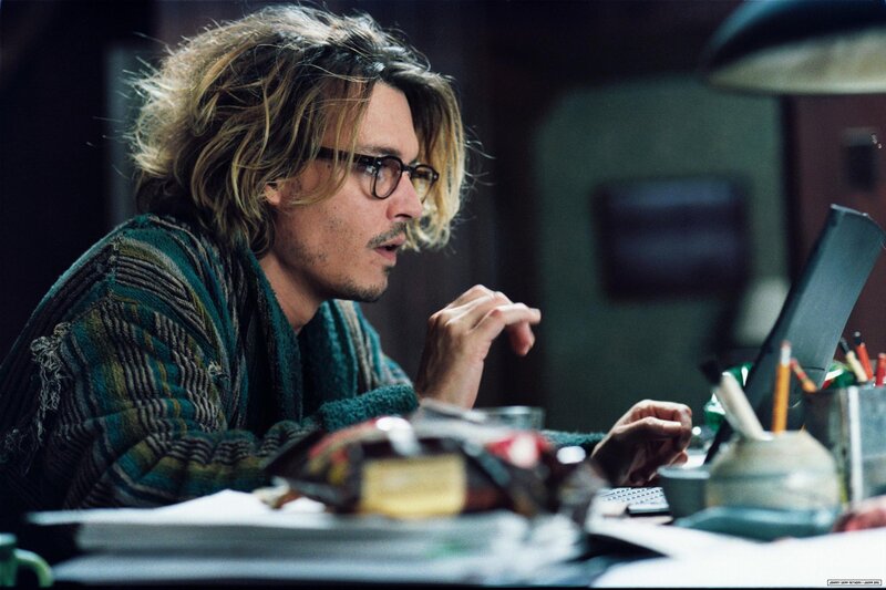 Man with Glasses at Desk