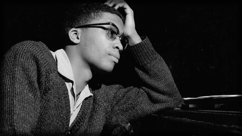 Man with Glasses at Piano