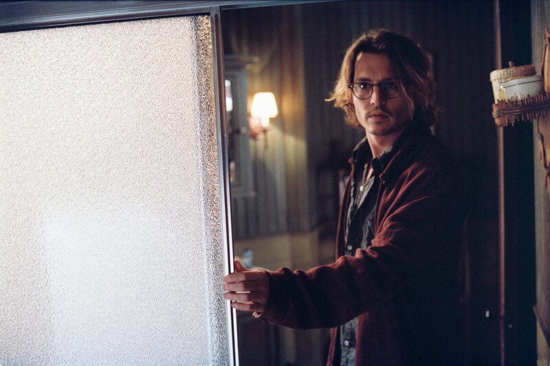 Man with Glasses Holding Door