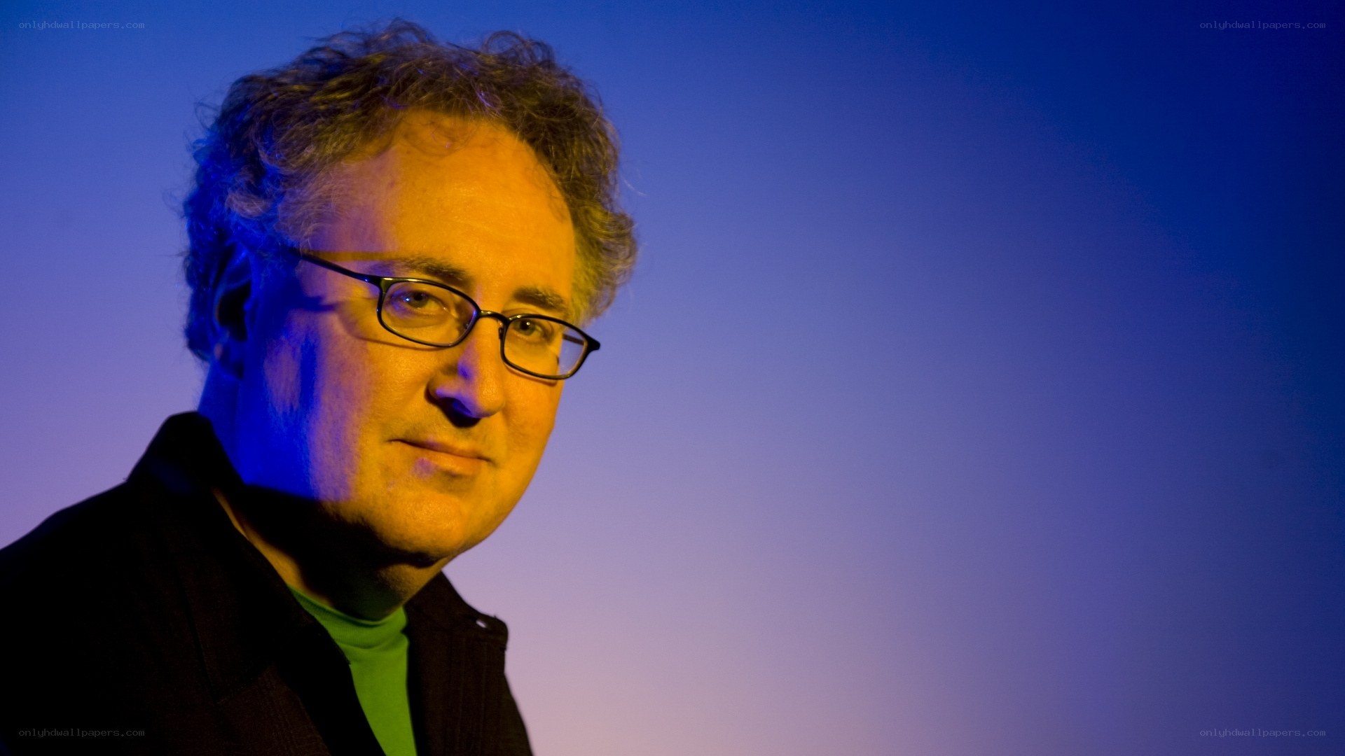 man with glasses in blue light
