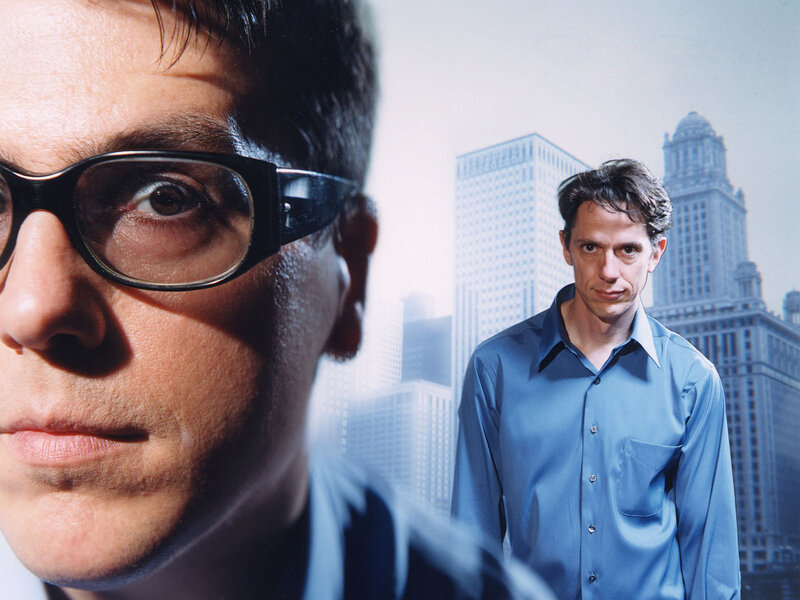 Man with glasses in city