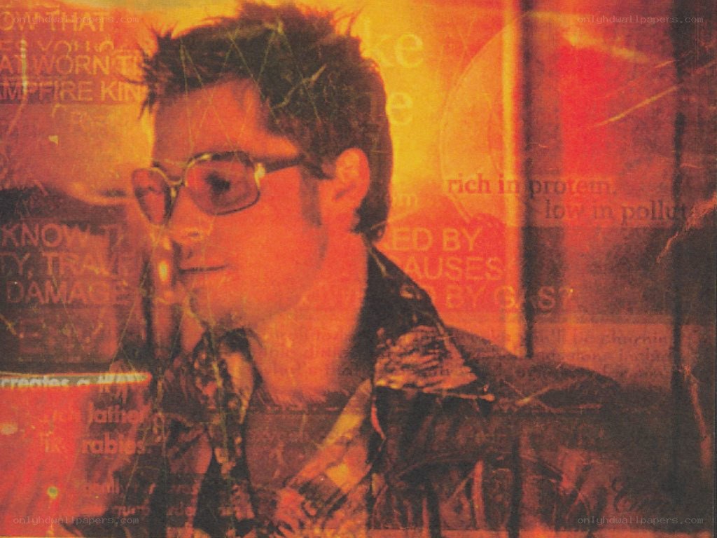 man with glasses in orange light