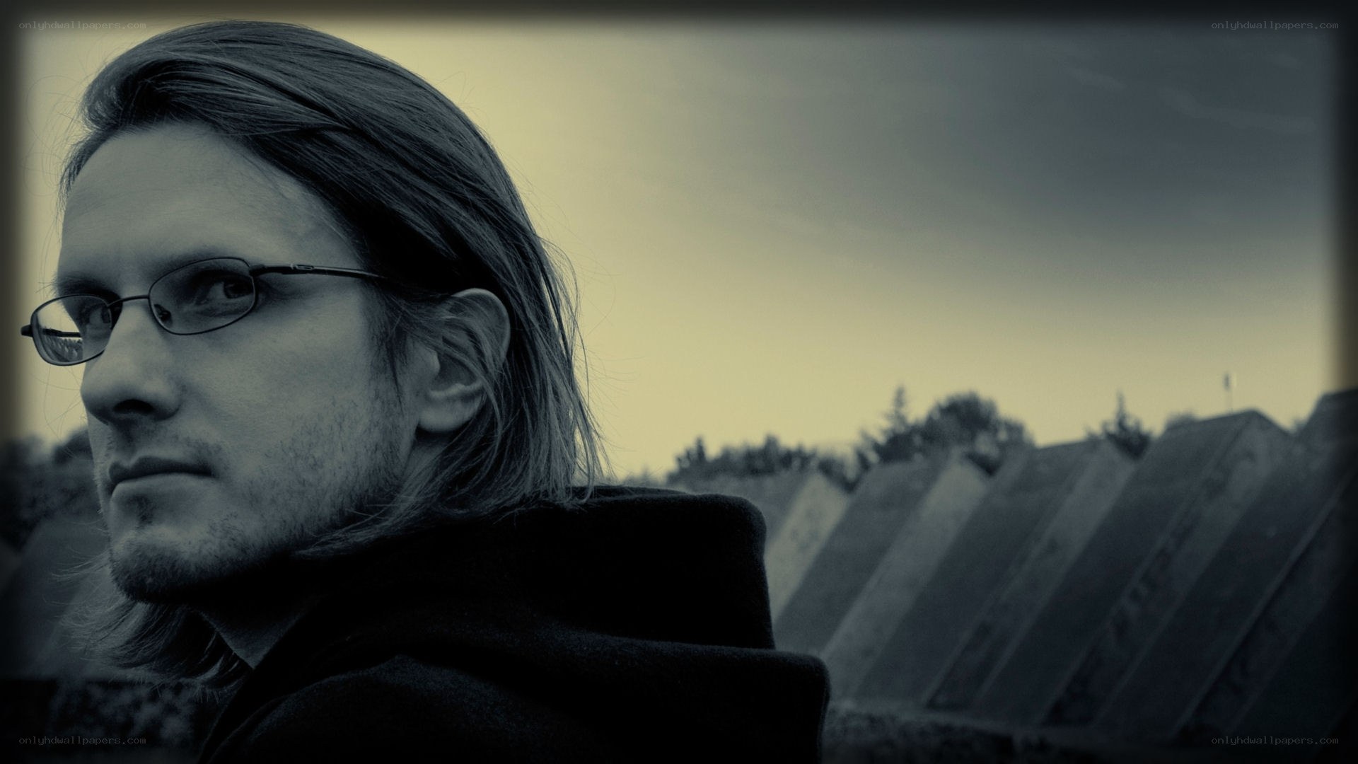 man with glasses in sepia