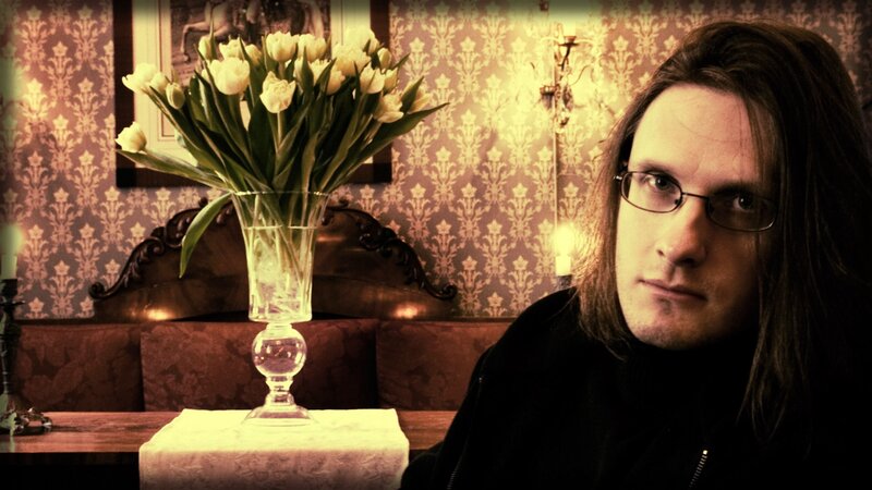 man with glasses in vintage room