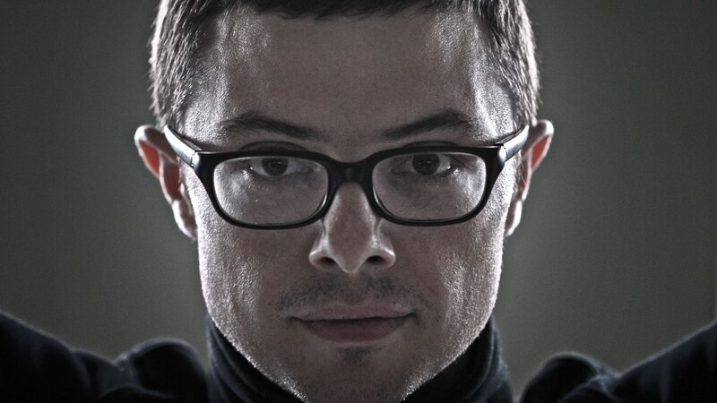 man with glasses looking at camera