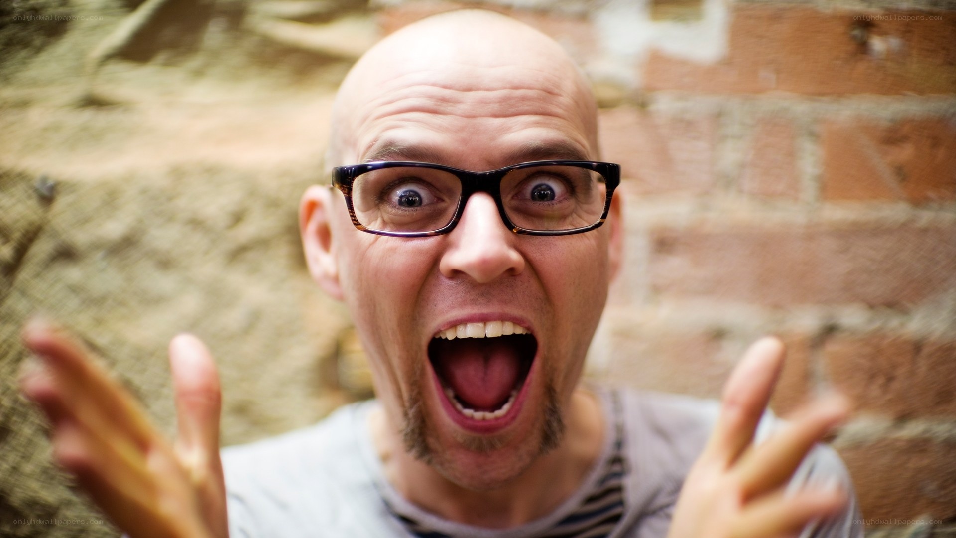 man with glasses making funny face