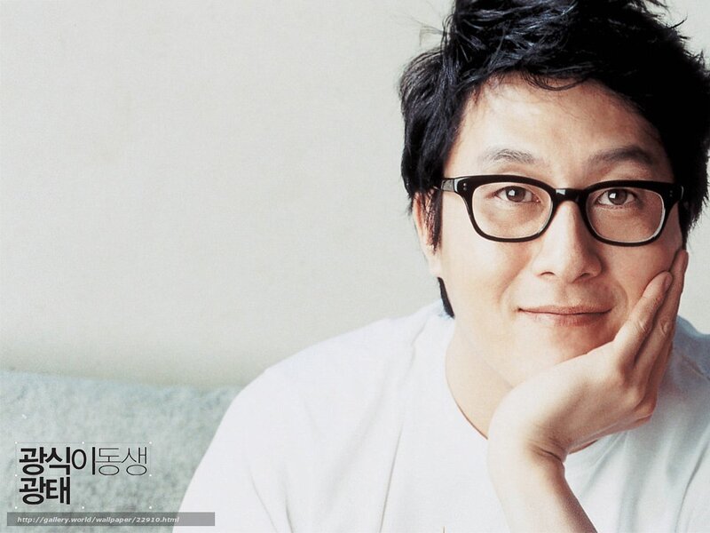man with glasses resting hand