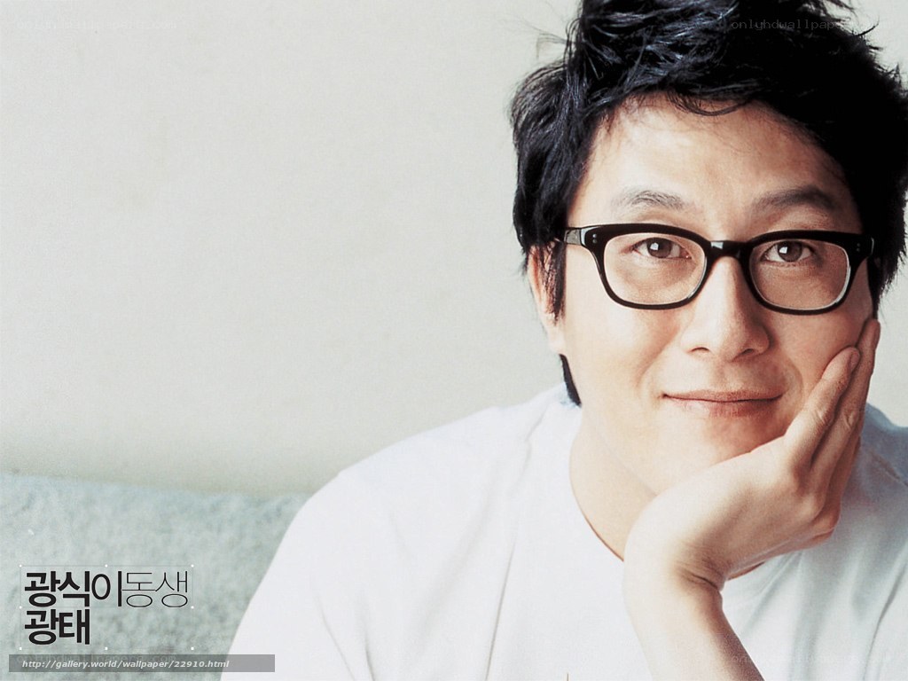 man with glasses resting hand