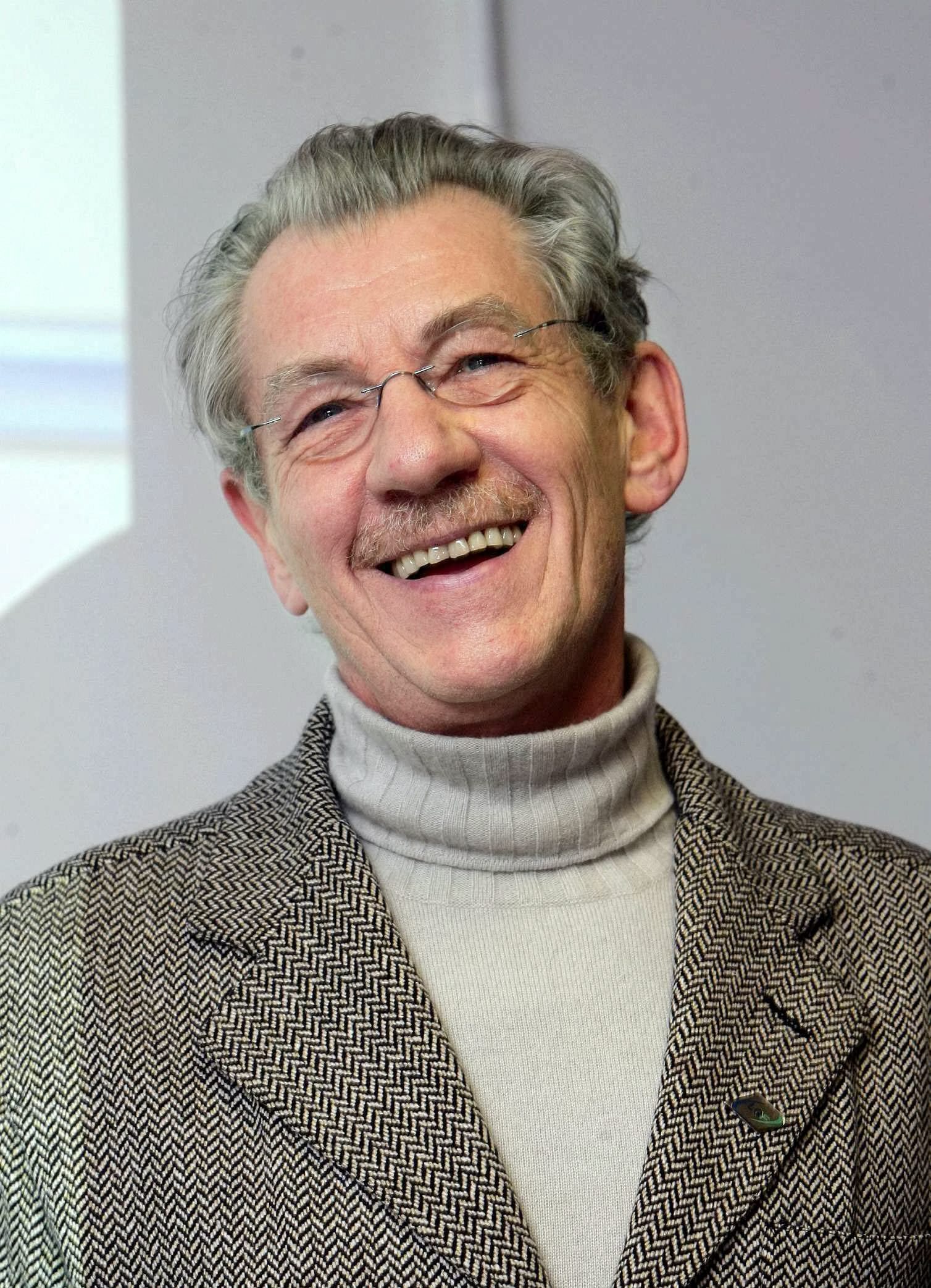 man with glasses smiling