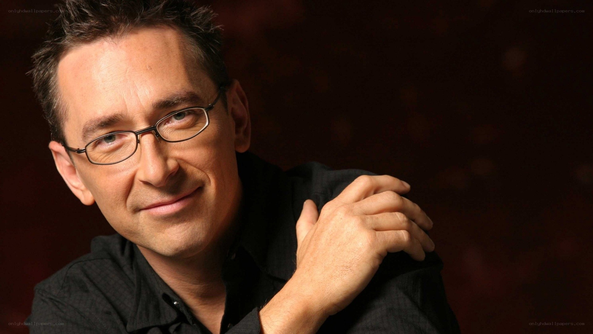 man with glasses smiling