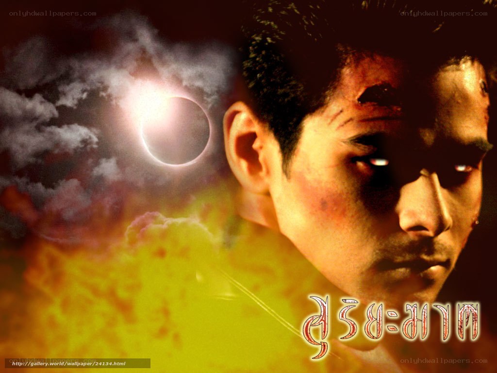 Man with glowing eyes and eclipse