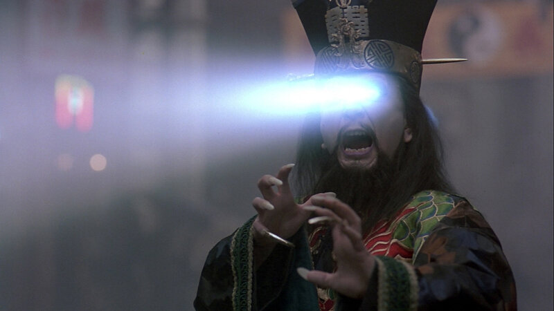 man with glowing eyes in traditional costume
