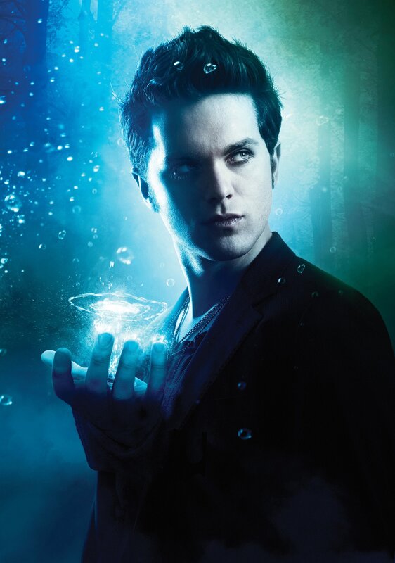 man with glowing orb in hand