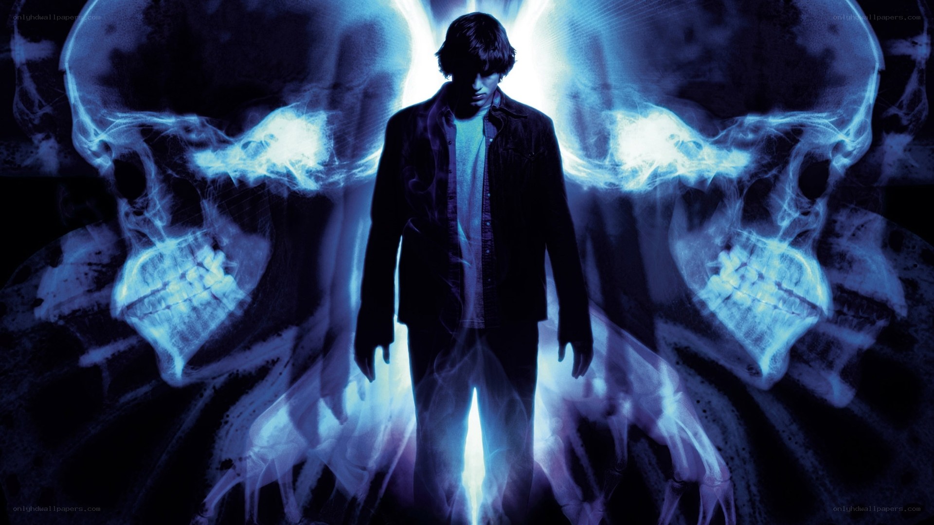 man with glowing skulls