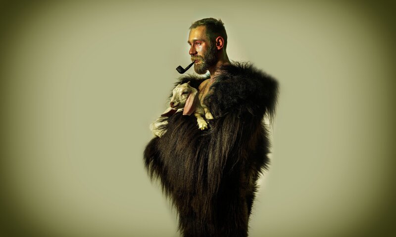 man with goat and pipe