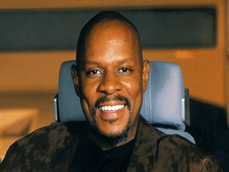 Man with Goatee Smiling — Brown
