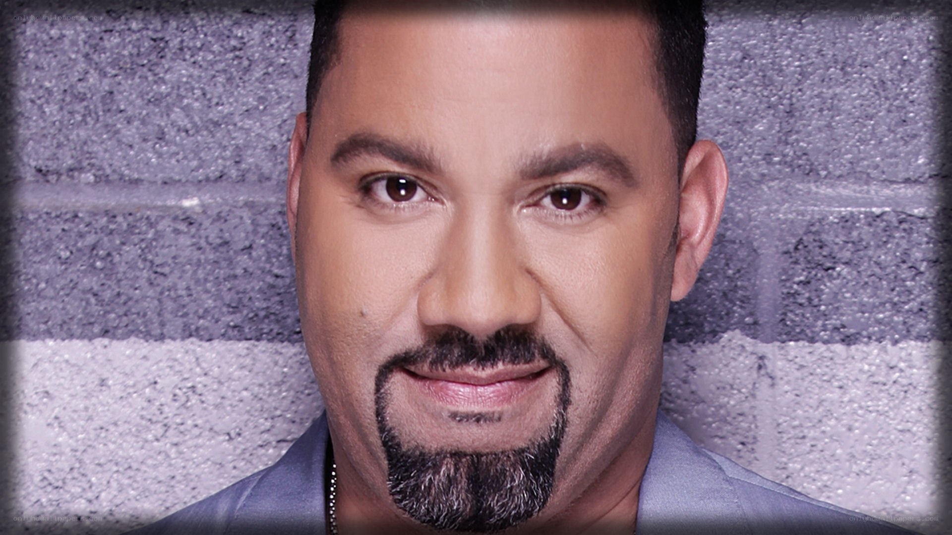 man with goatee smiling