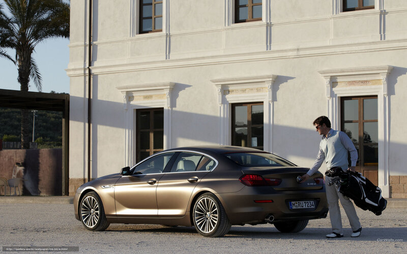 man with golf bag near car