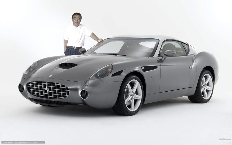 Man with gray Ferrari sports car