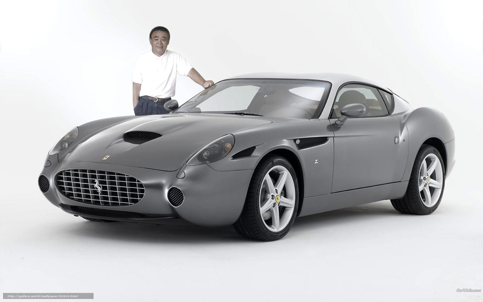 Man with gray Ferrari sports car
