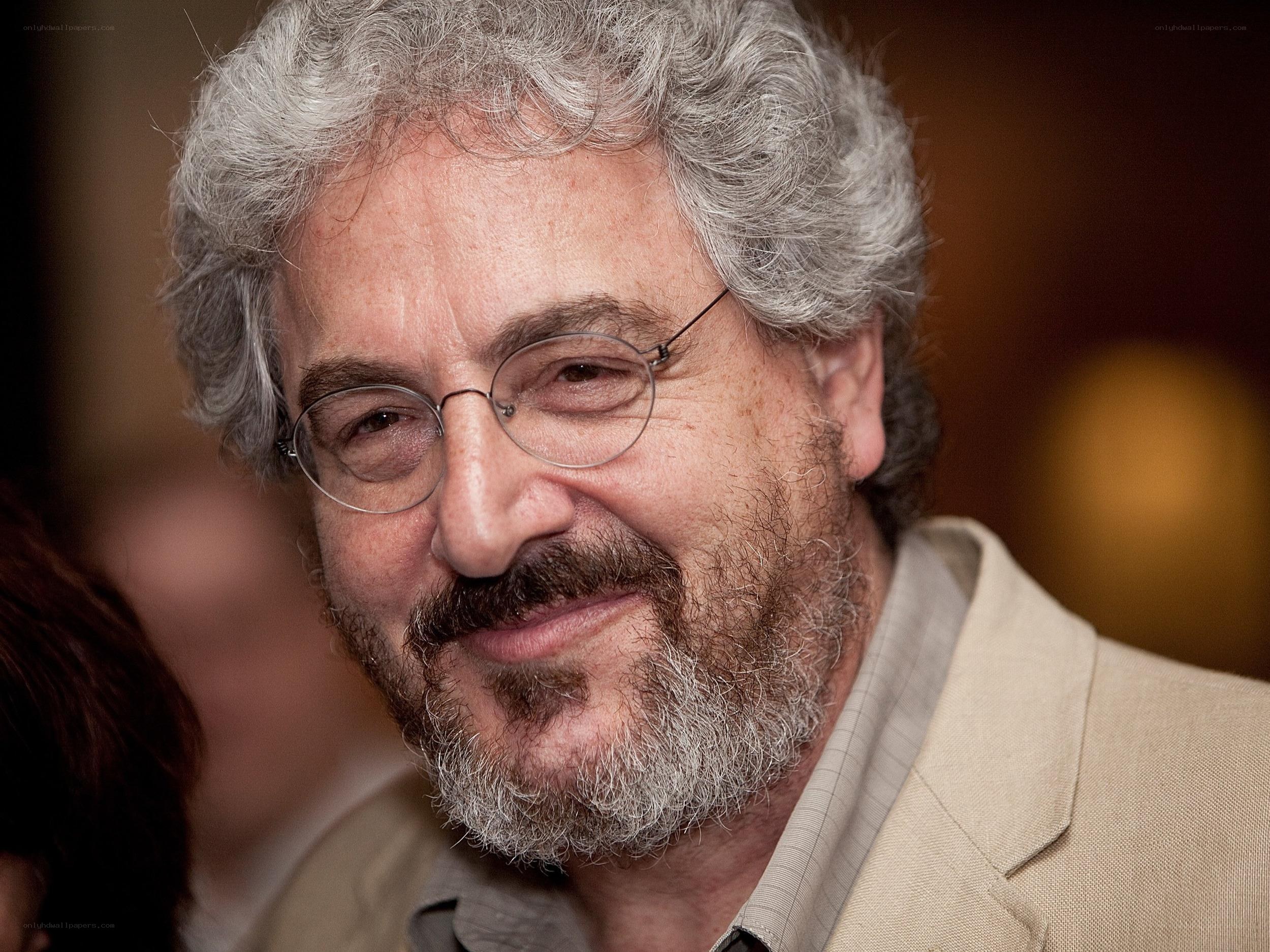 man with gray hair and glasses