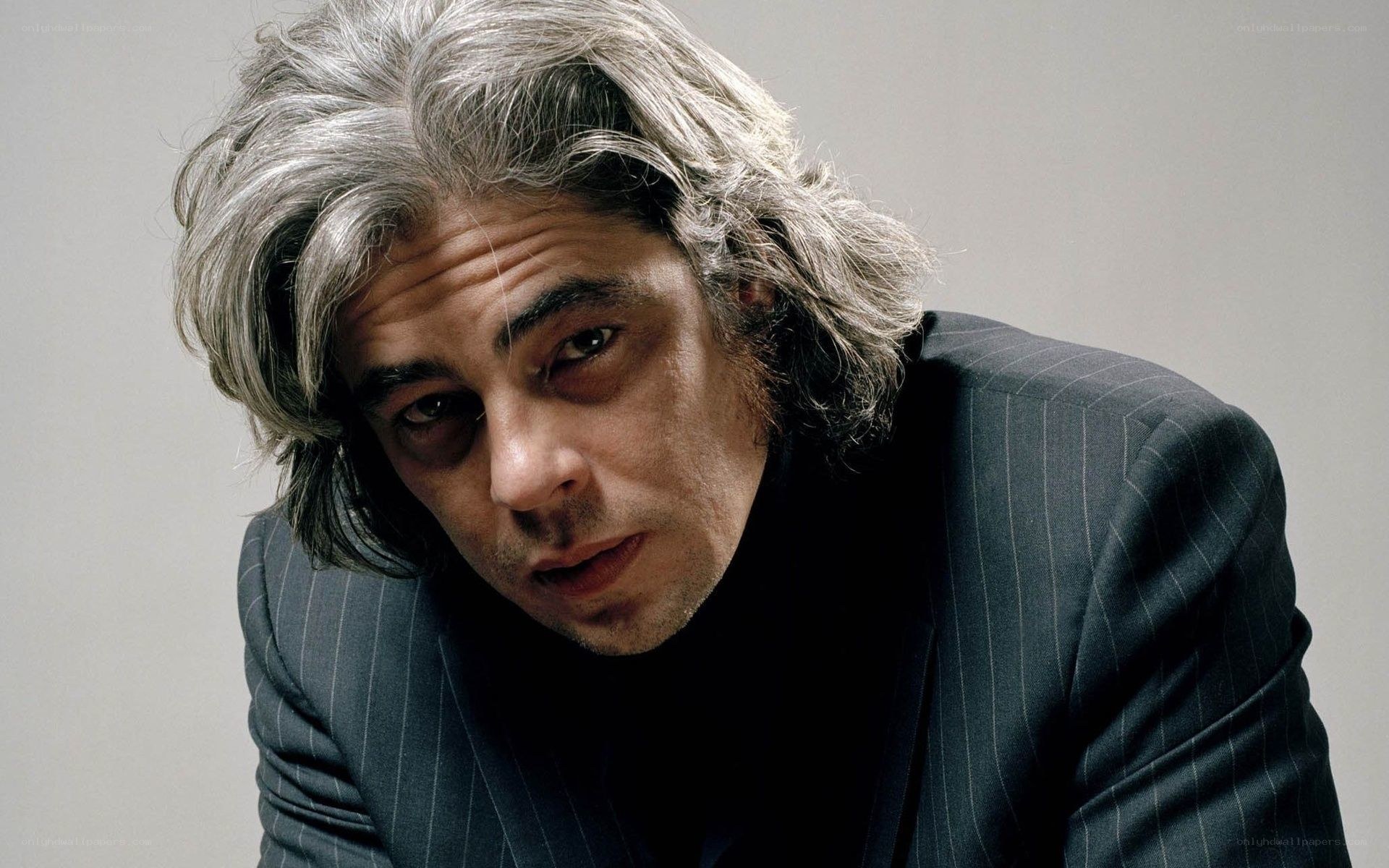 man with gray hair in suit