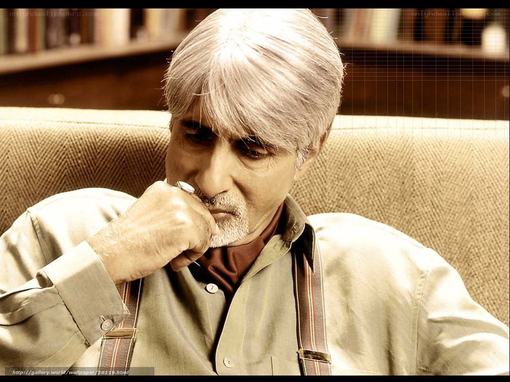 man with gray hair sitting thoughtfully