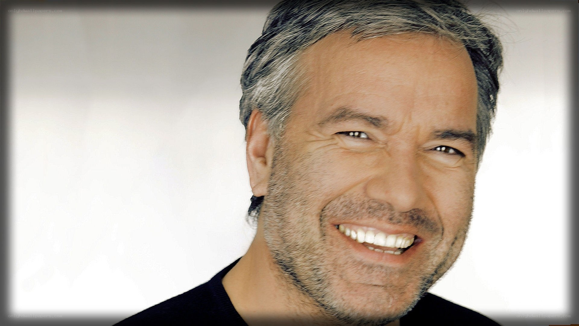 man with gray hair smiling