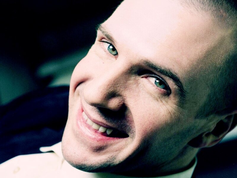 man with green eyes smiling