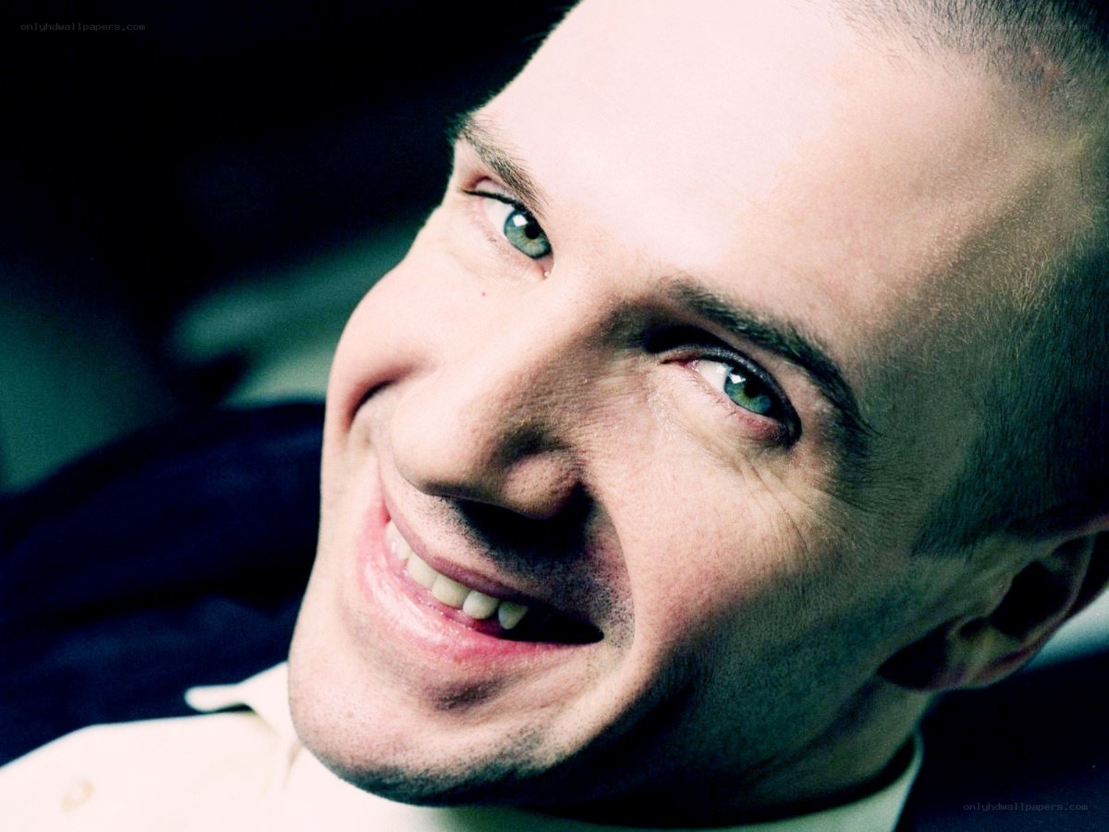 man with green eyes smiling