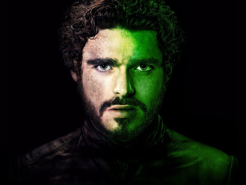 man with green-lit face