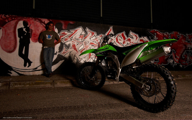 Man with green motorcycle