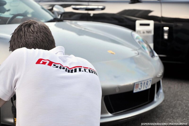 Man with GT Spirit shirt near Porsche