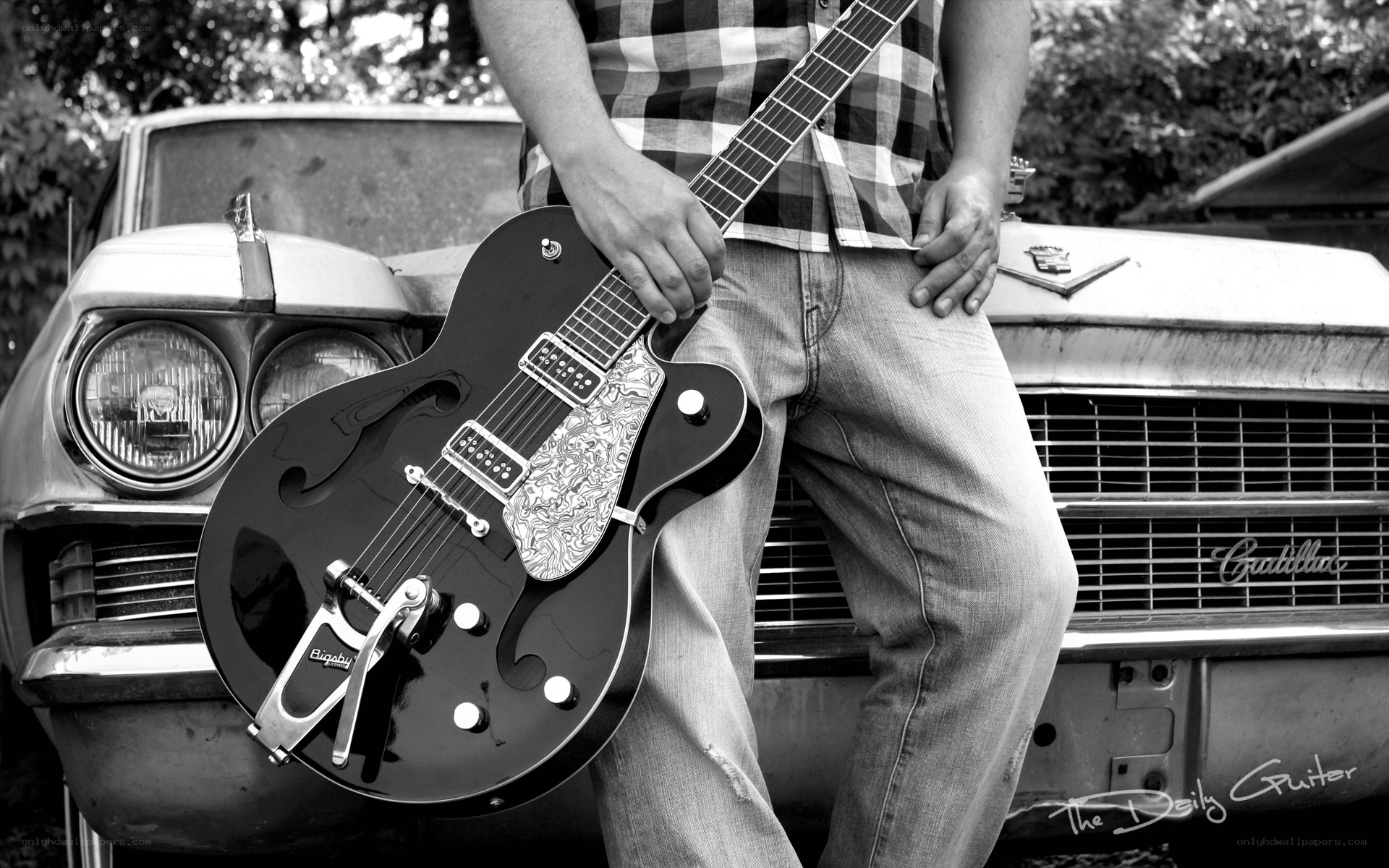 man with guitar and classic car