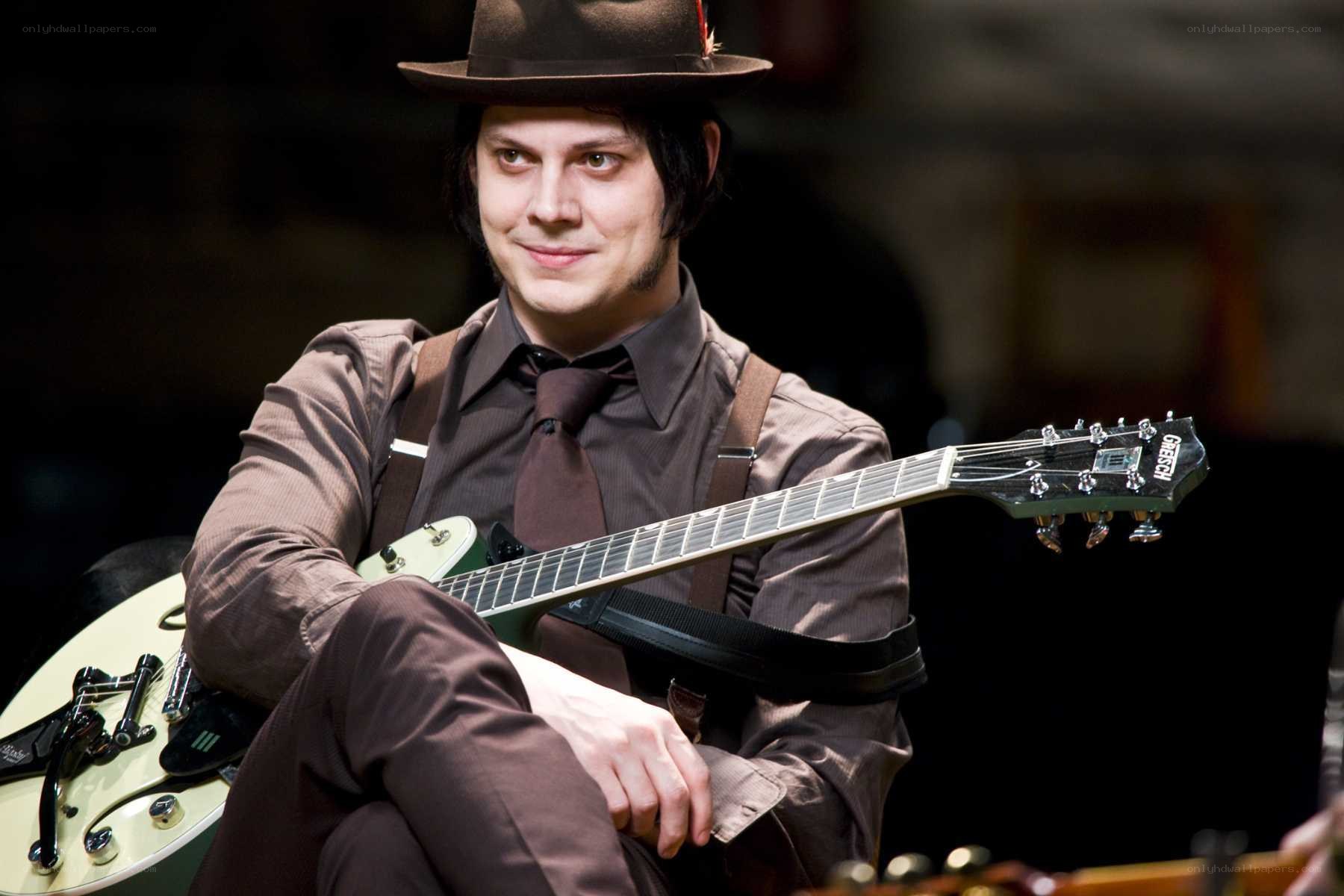 man with guitar and hat