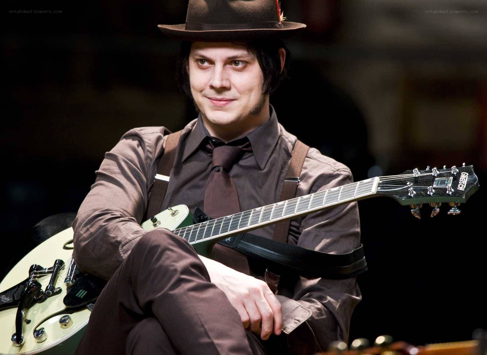 man with guitar and hat