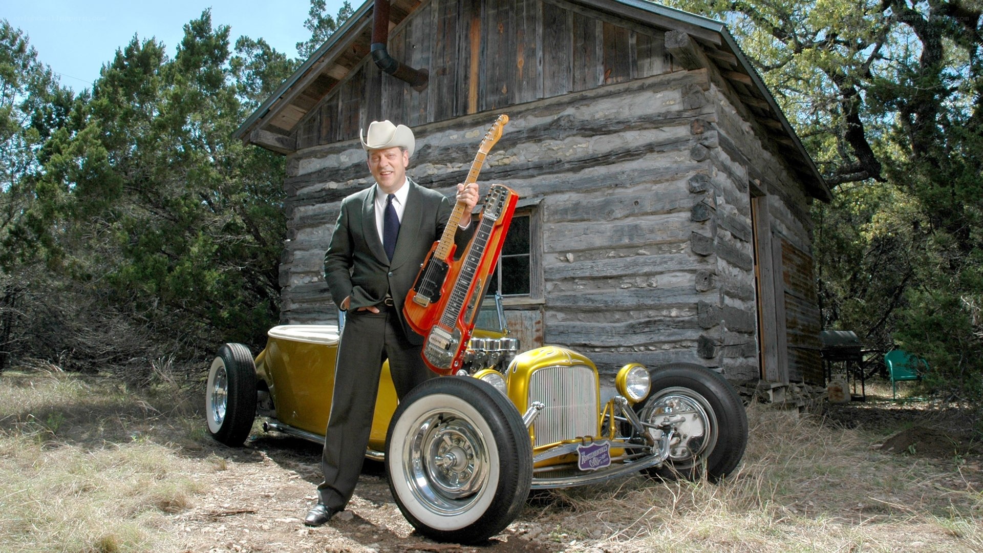 Man with guitar and hot rod