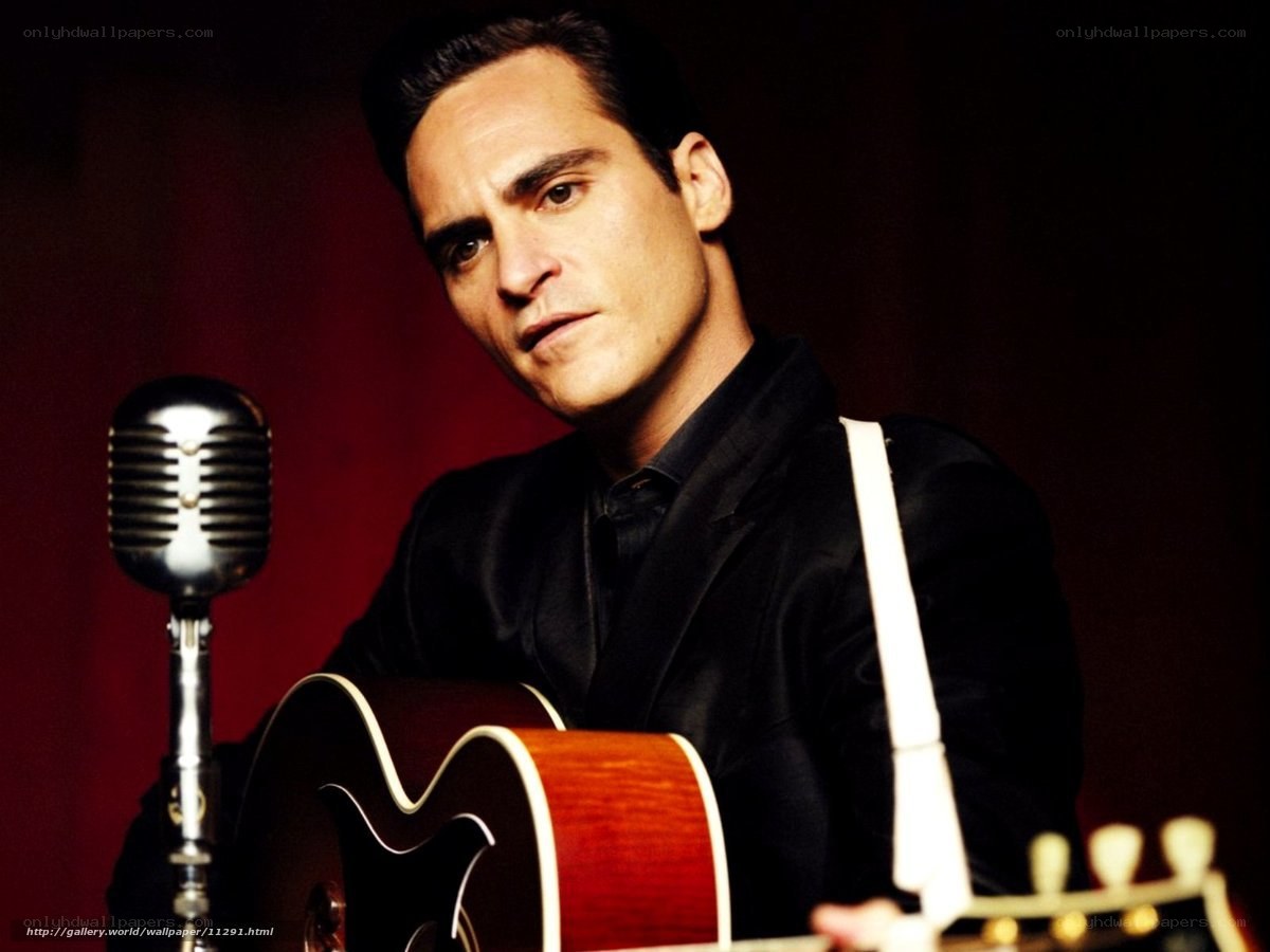 Man with guitar and microphone