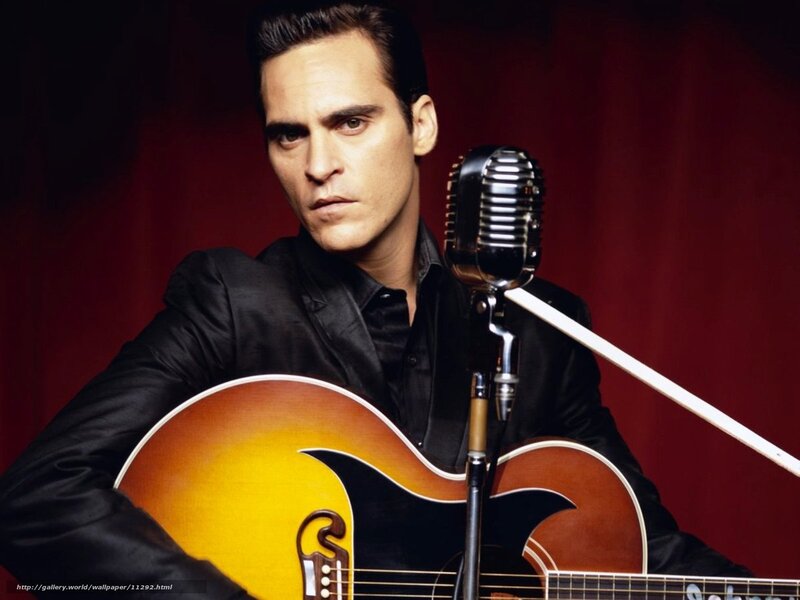 man with guitar and microphone