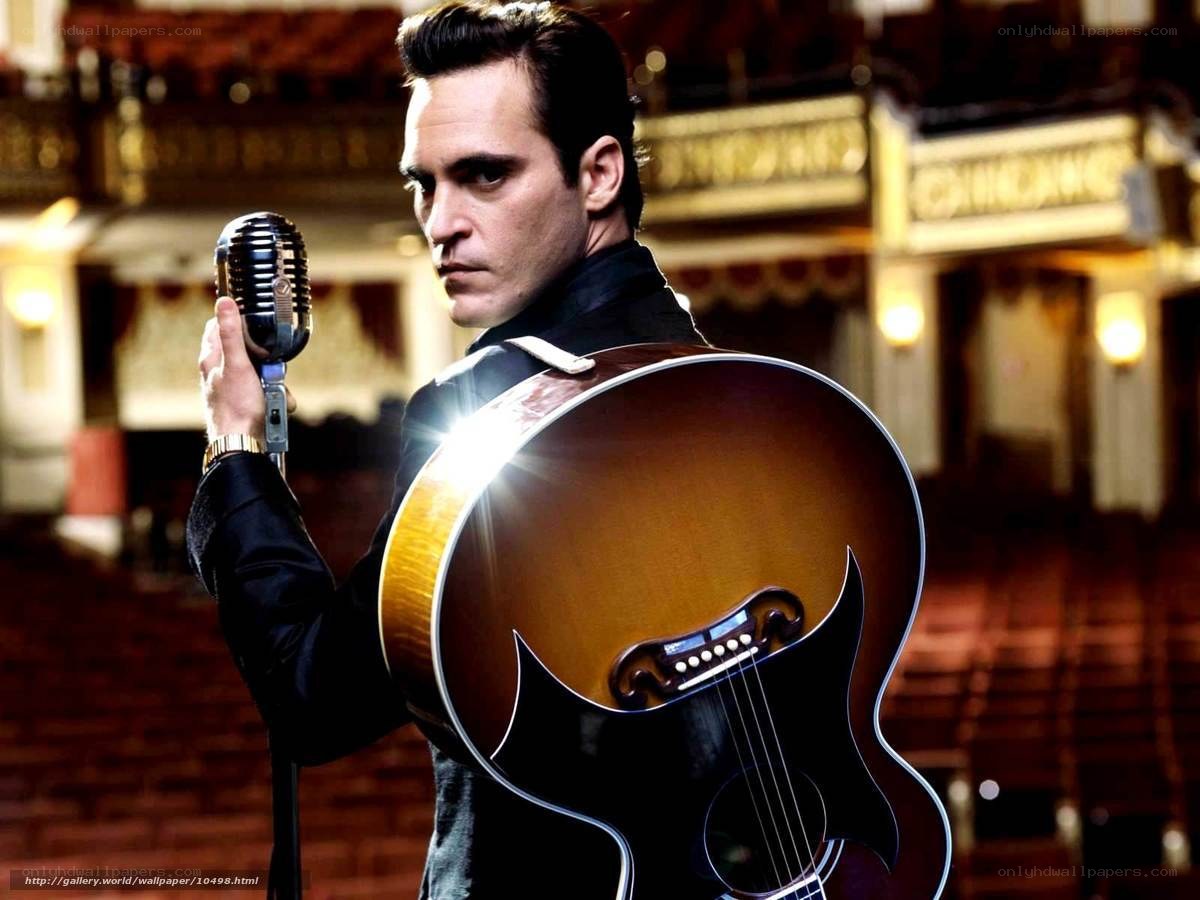 Man with guitar and microphone