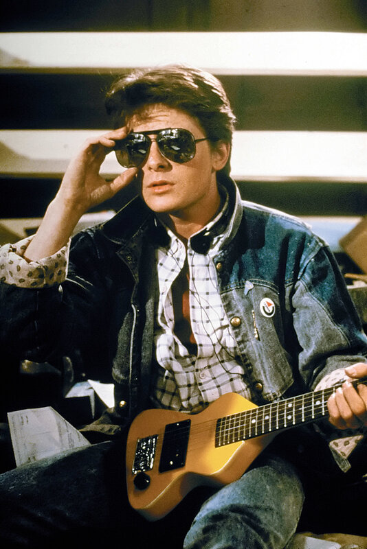 Man with guitar and sunglasses