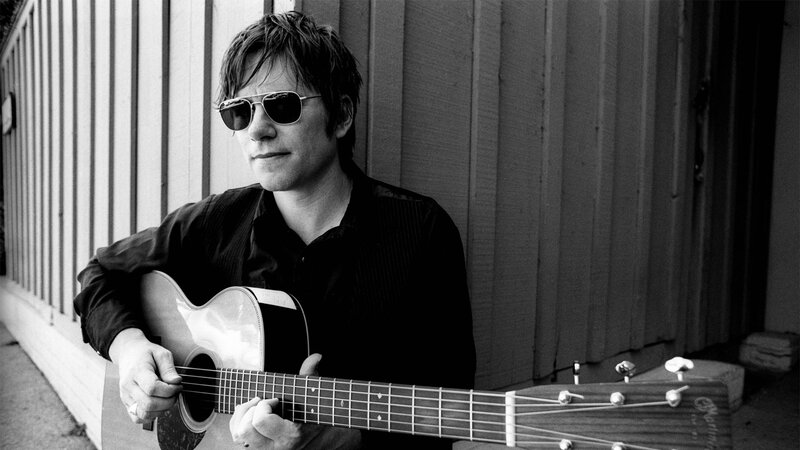 Man with Guitar — Black, Contemplative