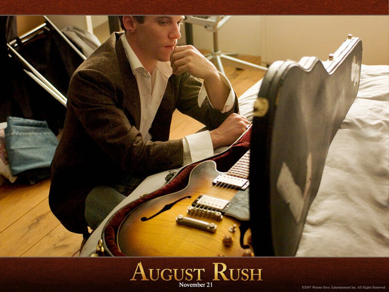 Man with Guitar Case — Brown, Contemplative