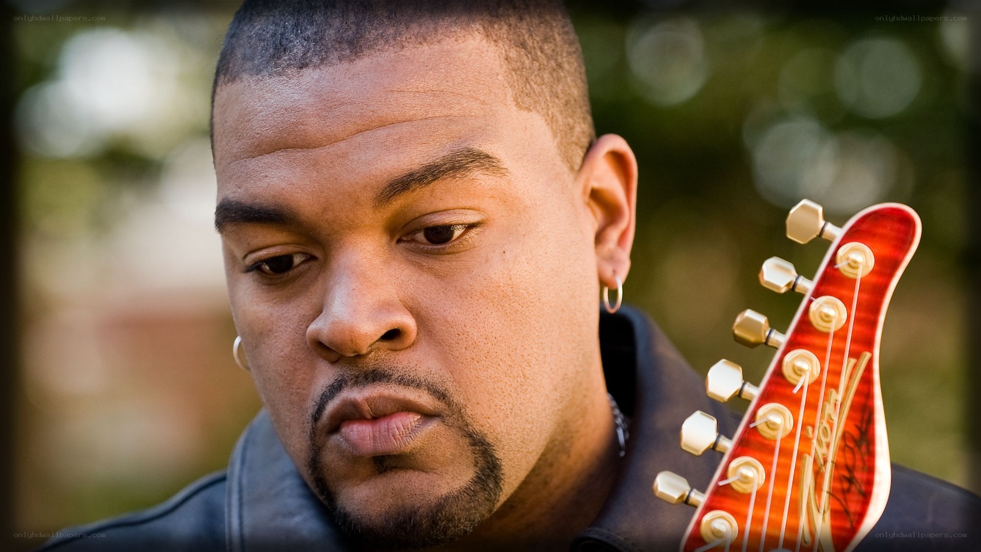 man with guitar headstock