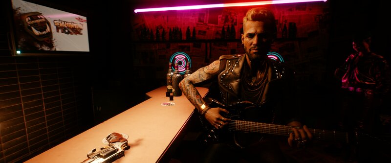 Man with Guitar in Bar