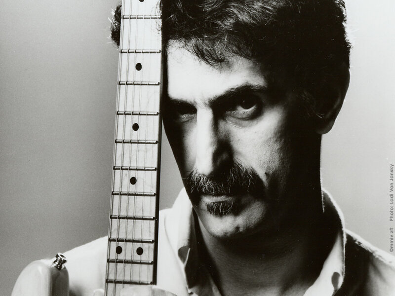 Man with guitar in black and white