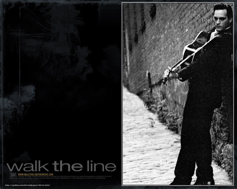 man with guitar on cobblestone path