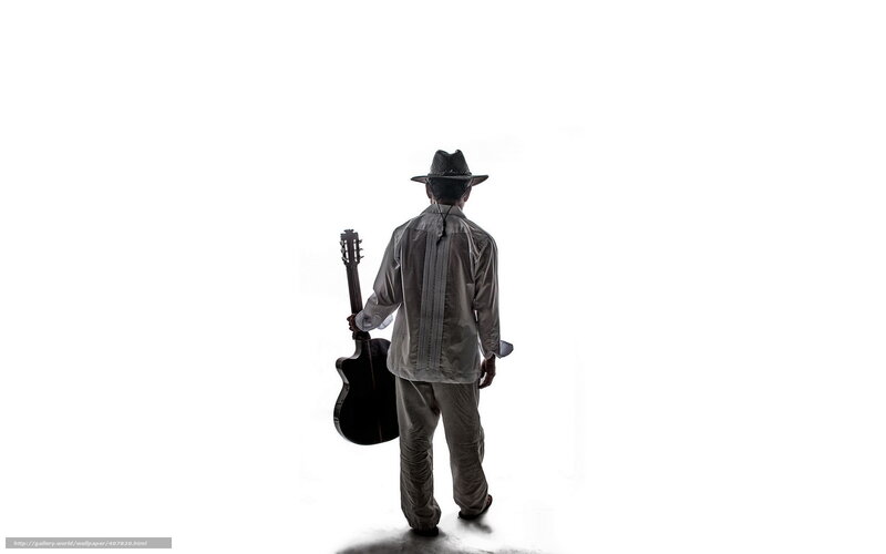 Man with guitar walking away