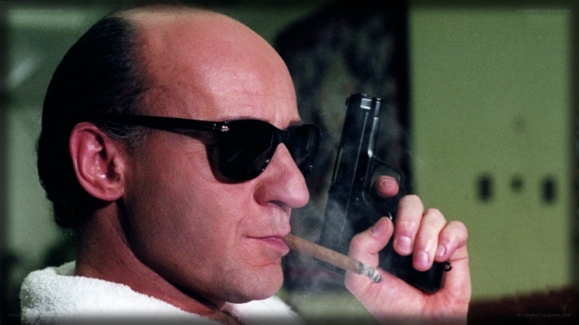 Man with gun and cigar